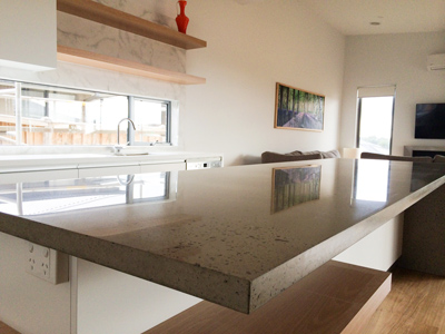 A polished concrete kitchen benchtop